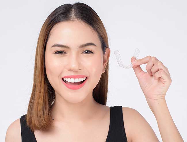 Girl is Hanging a Clear Braces
