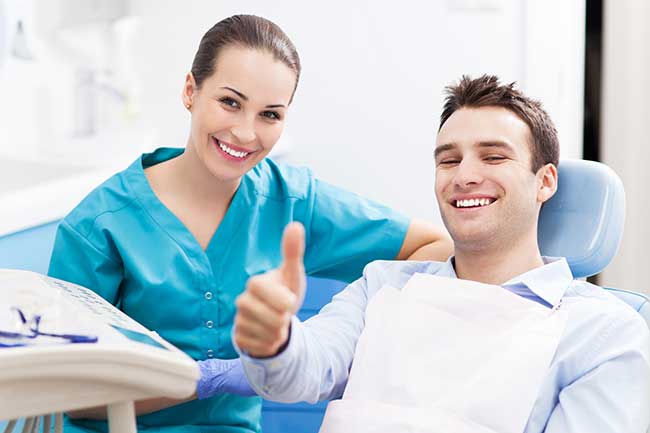 Lady Doctor with Happy Patient in Clinic